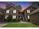 Inviting two-story condo with well-maintained landscaping and a beautiful exterior paint job at sunset at 8327 Childs Cove Cir, North Charleston, SC 29418