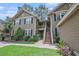 Inviting two-story condo with well-maintained landscaping and a beautiful exterior paint job at 8327 Childs Cove Cir, North Charleston, SC 29418