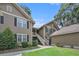 Exterior view of a multi-story home with mature landscaping at 8327 Childs Cove Cir, North Charleston, SC 29418