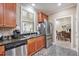 The kitchen is equipped with stainless steel appliances and granite countertops at 8327 Childs Cove Cir, North Charleston, SC 29418