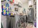 Modern laundry room with updated appliances and shelving for storage at 8327 Childs Cove Cir, North Charleston, SC 29418
