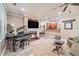 Cozy living room featuring a fireplace, ceiling fan, and a view into the kitchen at 8327 Childs Cove Cir, North Charleston, SC 29418