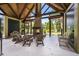 Outdoor pavilion has a brick fireplace surrounded by seating and is great for gathering with friends and Gathering at 8327 Childs Cove Cir, North Charleston, SC 29418