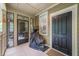 Enclosed porch featuring a covered grill and tiled flooring near the home's entrance at 8327 Childs Cove Cir, North Charleston, SC 29418