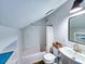 Bright bathroom showcasing a shower over a bathtub, with modern fixtures and a vanity sink at 837 Club Cottage Rd, Edisto Island, SC 29438