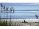 Wide beach featuring calming blue waters and a sandcastle perfect for relaxation and recreation at 837 Club Cottage Rd, Edisto Island, SC 29438