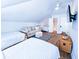 Spacious bedroom with multiple beds, seating area, and light wood floors at 837 Club Cottage Rd, Edisto Island, SC 29438