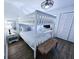 Bright bedroom featuring a bunk bed, stylish bench and a neutral palette for a calming atmosphere at 837 Club Cottage Rd, Edisto Island, SC 29438