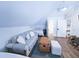 Inviting bedroom featuring a couch and two beds, creating a versatile and cozy living space at 837 Club Cottage Rd, Edisto Island, SC 29438