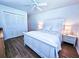 Serene bedroom with a white bed, matching nightstands, and ample closet space at 837 Club Cottage Rd, Edisto Island, SC 29438