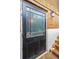 Vintage glass door leading to basement with brick steps at 88 Smith St, Charleston, SC 29401