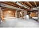 Spacious unfinished basement with exposed beams and brick walls at 88 Smith St, Charleston, SC 29401