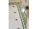 Close-up of bathroom floor, showcasing classic white tiles with a decorative green Greek key pattern at 88 Smith St, Charleston, SC 29401
