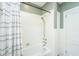 Clean bathroom featuring a white tub and shower combination with neutral-striped shower curtain at 88 Smith St, Charleston, SC 29401