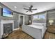 Cozy bedroom features a fireplace, ceiling fan, and comfortable king-size bed with a padded headboard at 88 Smith St, Charleston, SC 29401