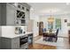 Dining area with table set next to gray cabinetry and beverage fridge at 88 Smith St, Charleston, SC 29401
