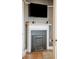 A charming fireplace with a decorative white mantle and dark gray tile surround, perfect for cozy evenings at 88 Smith St, Charleston, SC 29401