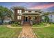 Charming two-story brick home with a welcoming front porch and beautiful brick walkway at 88 Smith St, Charleston, SC 29401