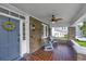 Cozy front porch with brick flooring, a ceiling fan, and comfortable seating, perfect for relaxing at 88 Smith St, Charleston, SC 29401