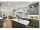 Gourmet kitchen featuring a center island, marble counters, and gray cabinetry at 88 Smith St, Charleston, SC 29401
