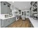 Modern kitchen with grey cabinets, marble countertops, stainless steel appliances, and a large island at 88 Smith St, Charleston, SC 29401
