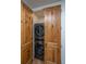 Efficient laundry closet with a modern stacked washer and dryer for convenient laundry at 88 Smith St, Charleston, SC 29401
