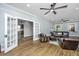 Spacious living room with hardwood floors, a ceiling fan, and open access to the kitchen at 88 Smith St, Charleston, SC 29401