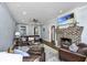Inviting living room with a brick fireplace, hardwood floors, and comfortable leather seating at 88 Smith St, Charleston, SC 29401