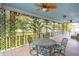 Spacious porch with an ornate ceiling fan and wrought-iron details at 88 Smith St, Charleston, SC 29401