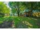 Lush backyard featuring a well-maintained garden, a charming treehouse, and ample green space for recreation at 103 Toura Ln, Charleston, SC 29414