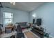 Basement recreation area with modern furniture, TV, and workout area at 103 Toura Ln, Charleston, SC 29414