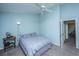 Inviting bedroom with carpet flooring, fan, light-blue walls, and access to the hallway at 103 Toura Ln, Charleston, SC 29414