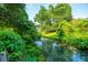 Picturesque view of a serene creek surrounded by lush greenery at 103 Toura Ln, Charleston, SC 29414