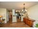 Dining room with hardwood floors, chandelier, and access to the kitchen at 103 Toura Ln, Charleston, SC 29414