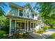 Charming two-story home with a welcoming front porch and well-manicured landscaping at 103 Toura Ln, Charleston, SC 29414