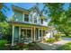 Charming two-story home with a welcoming front porch, landscaped yard, and inviting curb appeal at 103 Toura Ln, Charleston, SC 29414