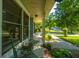 Inviting front porch with comfortable seating, offering a relaxing outdoor space and views of the neighborhood at 103 Toura Ln, Charleston, SC 29414