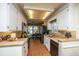 Well-lit kitchen featuring white cabinets, black appliances and granite countertops at 103 Toura Ln, Charleston, SC 29414