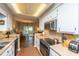 Well-lit kitchen boasts modern appliances and a tile floor at 103 Toura Ln, Charleston, SC 29414