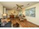Bright living room featuring hardwood floors, a ceiling fan, and lots of natural light at 103 Toura Ln, Charleston, SC 29414