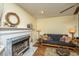 Comfortable living room with fireplace, futon, and hardwood floors at 103 Toura Ln, Charleston, SC 29414