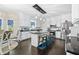 Bright kitchen with a black island, stainless steel appliances, and white cabinets at 105 Birkbeck Ct, Goose Creek, SC 29445