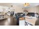 Spacious living room with hardwood floors, leather sofas, and bright lighting at 105 Birkbeck Ct, Goose Creek, SC 29445