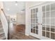 Welcoming foyer with staircase and a glimpse into the open-concept layout, showcasing modern design at 107 Orchard Blossom Ln, Summerville, SC 29485