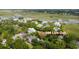 Aerial view of a waterfront community with marsh views and mature trees at 108 Live Oak Dr, Mount Pleasant, SC 29464