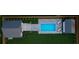 Overhead view of a backyard featuring a pool, lounge chairs, and lush green landscaping at 108 Live Oak Dr, Mount Pleasant, SC 29464