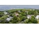 Stunning aerial view of waterfront neighborhood with lush trees and beautiful homes at 108 Live Oak Dr, Mount Pleasant, SC 29464