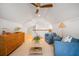 Cozy attic living room with vaulted ceiling, ceiling fan, and stylish decor for a relaxed atmosphere at 108 Live Oak Dr, Mount Pleasant, SC 29464