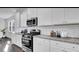 Bright kitchen featuring white cabinets and stainless steel appliances at 109 Orchard Blossom Ln, Summerville, SC 29485