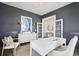 Stylish office with dark gray walls, white trim and fixtures, and french doors at 109 Orchard Blossom Ln, Summerville, SC 29485
